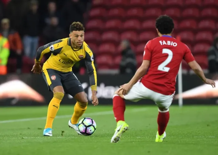 Framed Print : Clash at Riverside: Oxlade-Chamberlain vs Fabio in Premier League Showdown Framed Print : Clash at Riverside: Oxlade-Chamberlain vs Fabio in Premier League Showdown