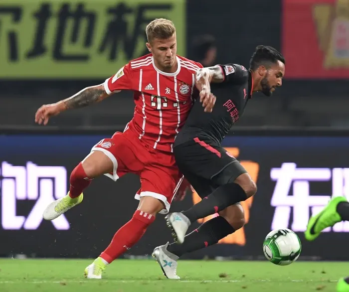 Framed Print : Clash in Shanghai: Walcott vs. Dorsch - Bayern Munich vs. Arsenal Pre-Season Friendly