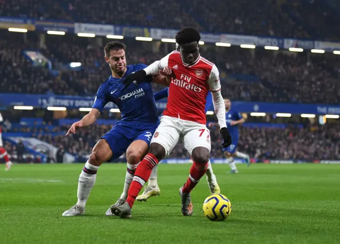 Framed Print : Clash of Skills: Saka vs Azpilicueta - A Premier League Showdown at Stamford Bridge Framed Print : Clash of Skills: Saka vs Azpilicueta - A Premier League Showdown at Stamford Bridge