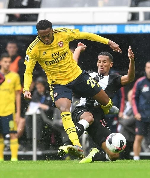 Clash at St. James Park: Arsenal's Joe Willock Faces Off Against Newcastle's Isaac Hayden