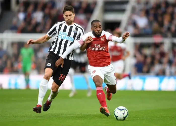 Framed Print : Clash at St. James Park: A Battle Between Lacazette and Fernandez - Arsenal vs. Newcastle United, Premier League 2018-19