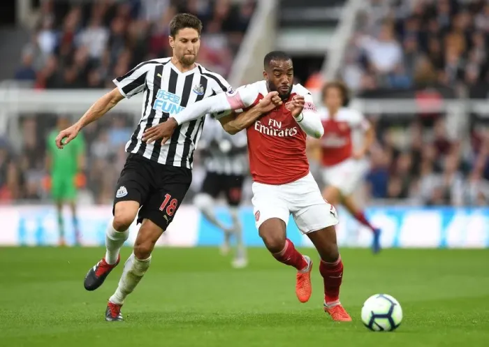 Framed Print : Clash at St. James Park: Lacazette vs. Fernandez - Newcastle United vs. Arsenal FC, Premier League 2018-19