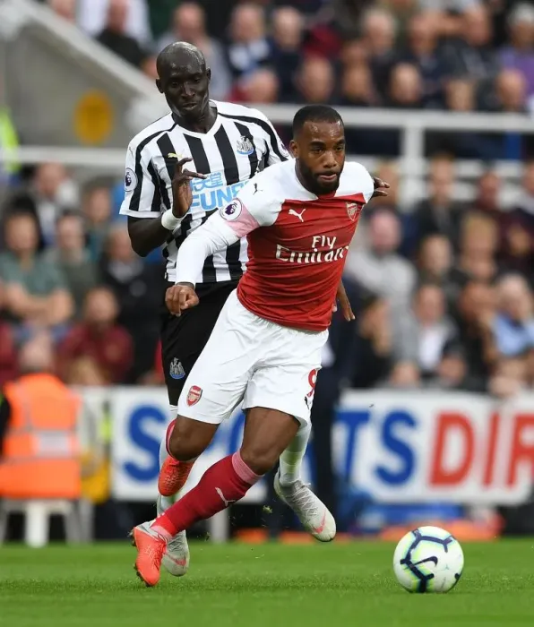 Framed Print : Clash at St. James Park: Lacazette vs Diame in Premier League Showdown Framed Print : Clash at St. James Park: Lacazette vs Diame in Premier League Showdown