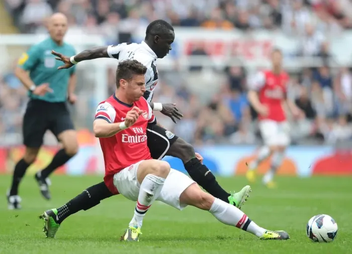 Framed Print : Clash at St. James Park: Olivier Giroud vs. Cheick Tiote, Newcastle United vs. Arsenal (Premier League 2012-13) Framed Print : Clash at St. James Park: Olivier Giroud vs. Cheick Tiote, Newcastle United vs. Arsenal (Premier League 2012-13)