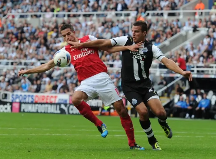 Framed Print : Clash at St. James Park: Robin van Persie vs. Ryan Taylor
