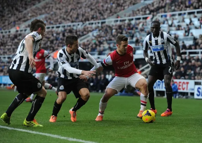 Framed Print : Clash at St. James Park: Wilshere Faces Off Against Newcastle Trio Framed Print : Clash at St. James Park: Wilshere Faces Off Against Newcastle Trio