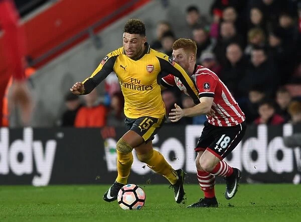 Clash at St. Mary's: Oxlade-Chamberlain vs. Reed in FA Cup Showdown (Southampton v Arsenal, 2017)
