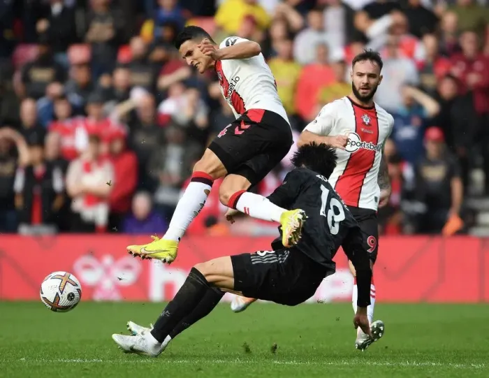 Framed Print : Clash at St. Mary's: Tomiyasu vs. Elyounoussi in Southampton v Arsenal Premier League Showdown