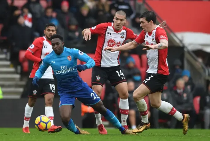 Framed Print : Clash at St. Mary's: Welbeck Faces Off Against Hojbjerg and Romeu in Southampton vs. Arsenal Premier League Showdown