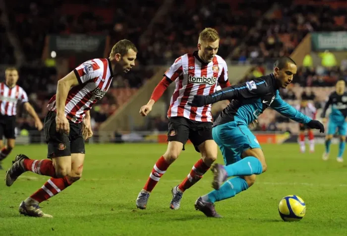 Framed Print : Clash at the Stadium of Light: Walcott vs Larsson and Bardsley in the FA Cup Battle between Sunderland and Arsenal