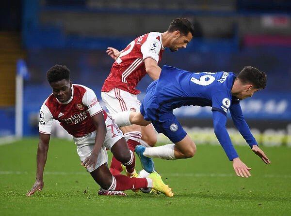 Clash at Stamford Bridge: Arsenal's Saka and Mari vs. Chelsea's Mount in the 2021 Premier League Showdown