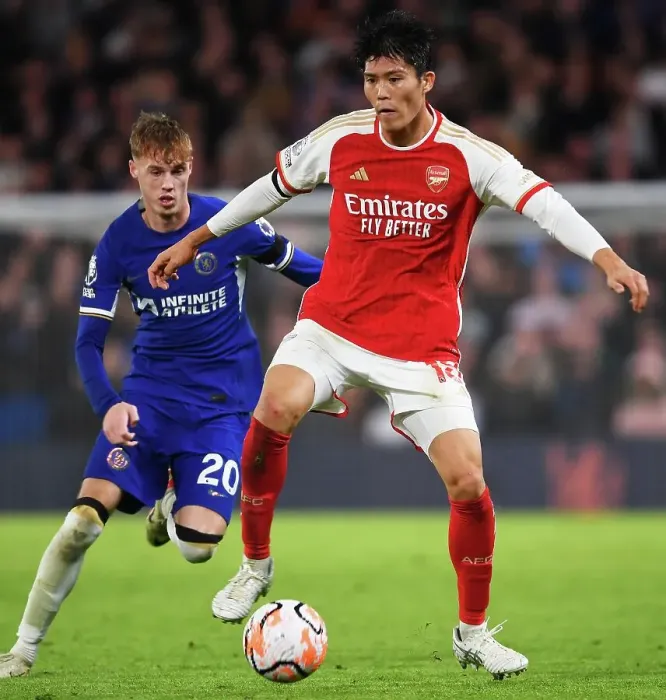 Framed Print : Clash at Stamford Bridge: Arsenal's Tomiyasu Fends Off Chelsea's Palmer (2023-24) Framed Print : Clash at Stamford Bridge: Arsenal's Tomiyasu Fends Off Chelsea's Palmer (2023-24)