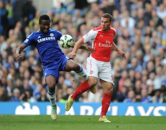 Framed Print : Clash at Stamford Bridge: Podolski vs. Mikel Obi - A Football Battle Framed Print : Clash at Stamford Bridge: Podolski vs. Mikel Obi - A Football Battle