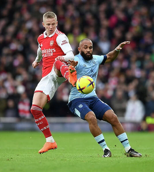 Clash of Stars: Arsenal's Zinchenko Goes Head-to-Head with Brentford's Mbeumo in Premier League Battle (Arsenal vs Brentford 2022-23)