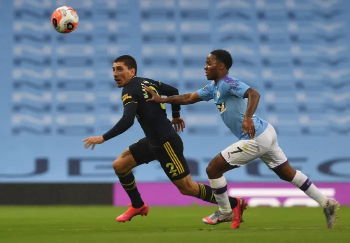 Framed Print : Clash of Stars: Bellerin vs Sterling - Manchester City vs Arsenal FC, Premier League 2019-20: Hector Bellerin vs Raheem Sterling Battle at Etihad Stadium