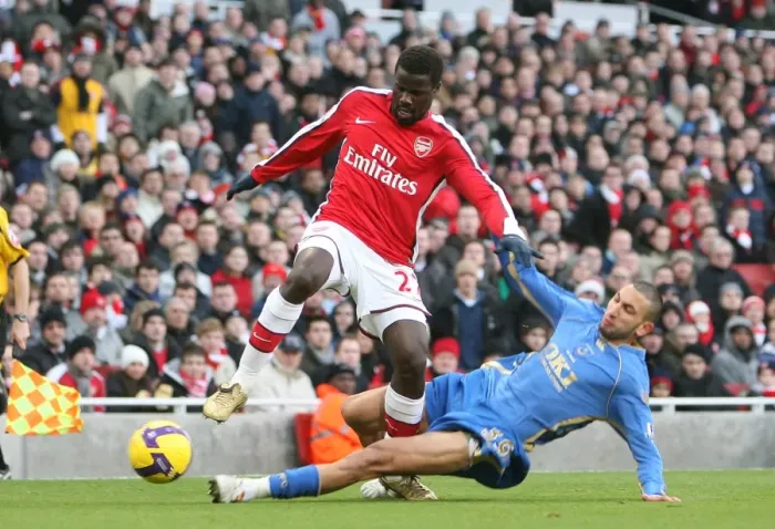 Framed Print : Clash of Stars: Eboue vs. Belhadj in Arsenal's 1-0 Victory over Portsmouth, 2008