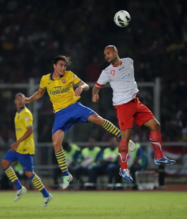 Framed Print : Clash of Stars: Ignasi Miquel vs. Sergio Van Duk (Arsenal vs. Indonesia All-Stars, 2013)