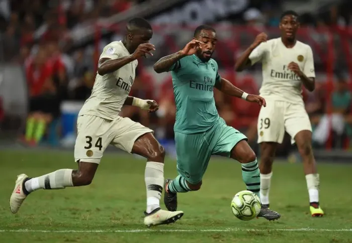 Framed Print : Clash of Stars: Lacazette vs. Nsoki in Arsenal's Battle Against PSG Framed Print : Clash of Stars: Lacazette vs. Nsoki in Arsenal's Battle Against PSG