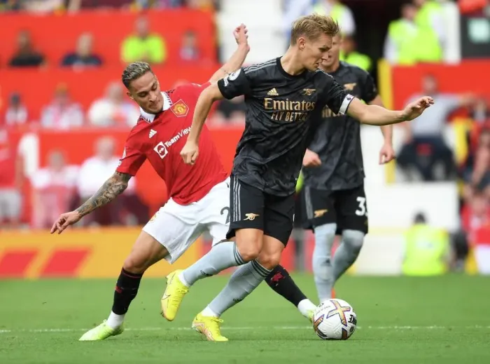 Framed Print : Clash of Stars: Odegaard vs. Antony - Premier League Showdown: Manchester United vs. Arsenal (2022-23) Framed Print : Clash of Stars: Odegaard vs. Antony - Premier League Showdown: Manchester United vs. Arsenal (2022-23)