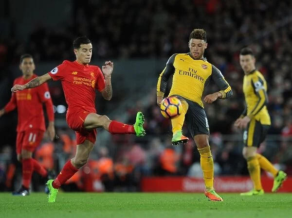 Clash of the Stars: Oxlade-Chamberlain vs. Coutinho - Liverpool vs. Arsenal Rivalry: A Battle at Anfield