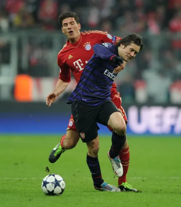 Framed Print : Clash of Stars: Rosicky vs. Gomez - The Intense Battle at the Allianz Arena (Bayern Munich vs. Arsenal 2012-13)