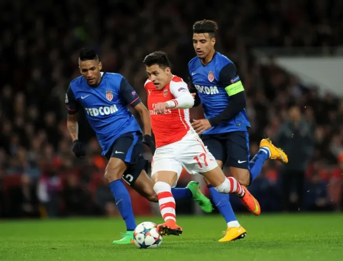Framed Print : Clash of Stars: Sanchez vs. Dirar, Martial in Arsenal's UEFA Champions League Battle against Monaco