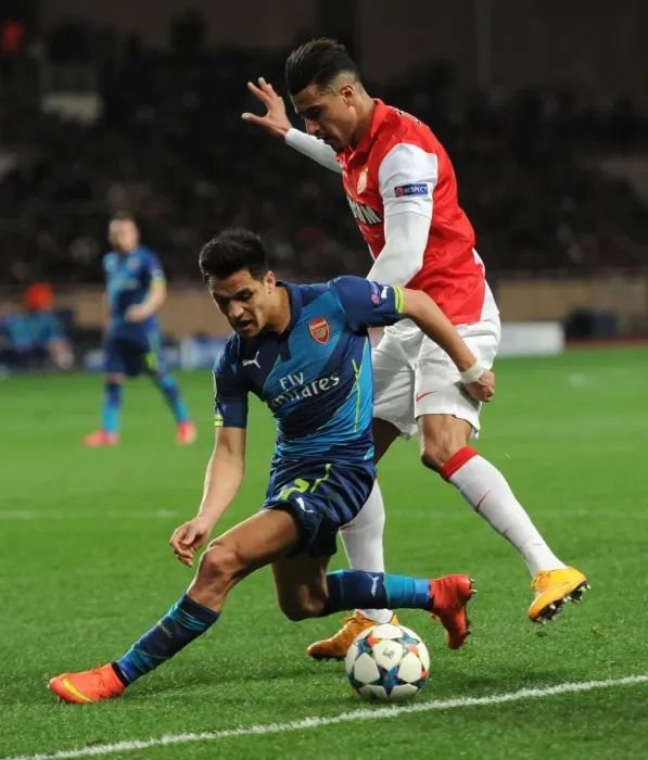 Framed Print : Clash of Stars: Sanchez vs. Dirar in Monaco vs. Arsenal UEFA Champions League Showdown Framed Print : Clash of Stars: Sanchez vs. Dirar in Monaco vs. Arsenal UEFA Champions League Showdown