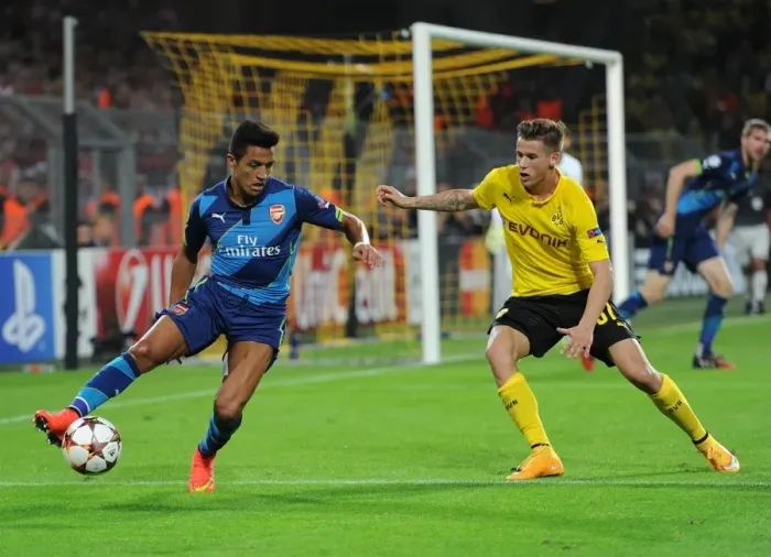 Framed Print : Clash of Stars: Sanchez vs. Durm - Borussia Dortmund vs. Arsenal, UEFA Champions League