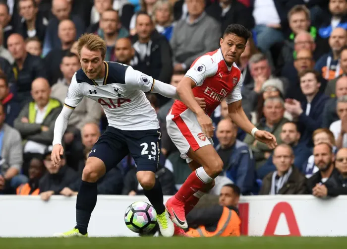 Framed Print : Clash of Stars: Sanchez vs. Eriksen in the Premier League Battle between Tottenham and Arsenal