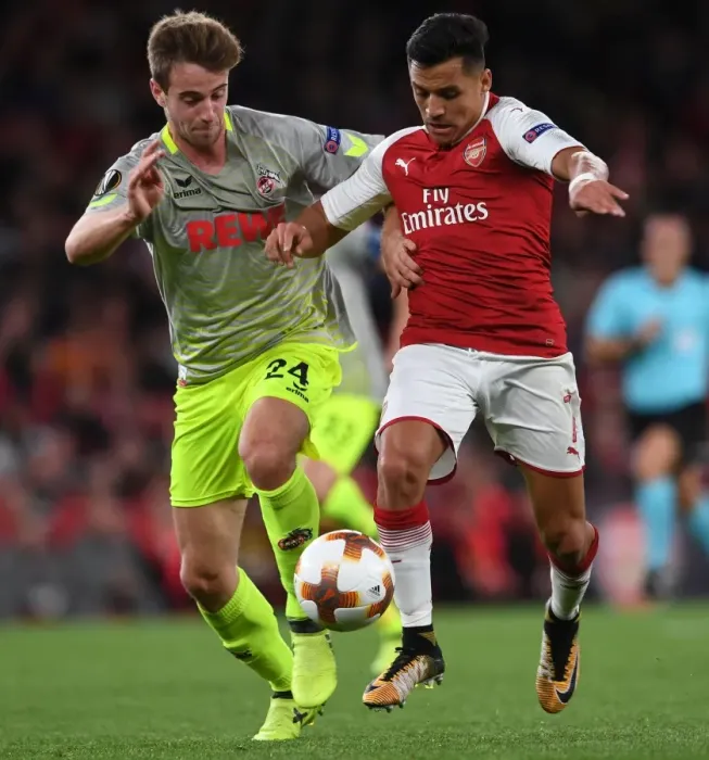 Framed Print : Clash of Stars: Sanchez vs. Klunter in Arsenal's Europa League Battle against 1. FC Koeln Framed Print : Clash of Stars: Sanchez vs. Klunter in Arsenal's Europa League Battle against 1. FC Koeln