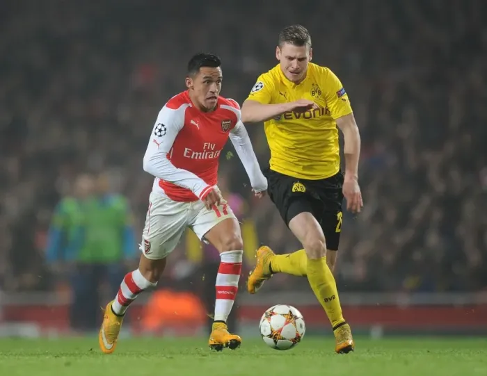 Framed Print : Clash of Stars: Sanchez vs. Piszczek - Arsenal vs. Borussia Dortmund, UEFA Champions League