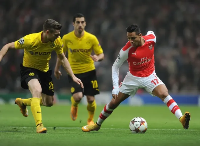Framed Print : Clash of Stars: Sanchez vs. Piszczek - Arsenal vs. Borussia Dortmund, UEFA Champions League