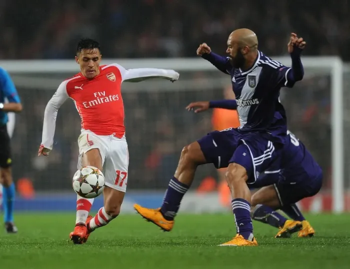 Framed Print : Clash of Stars: Sanchez vs. Vanden Borre in Arsenal's UEFA Champions League Battle