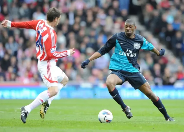 Framed Print : Clash of Styles: Abou Diaby vs. Rory Delap - Stoke City vs. Arsenal, Premier League