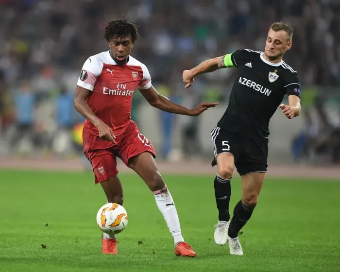 Framed Print : Clash of Styles: Alex Iwobi vs Maksim Medvedev in UEFA Europa League Showdown between Qarabag and Arsenal Framed Print : Clash of Styles: Alex Iwobi vs Maksim Medvedev in UEFA Europa League Showdown between Qarabag and Arsenal
