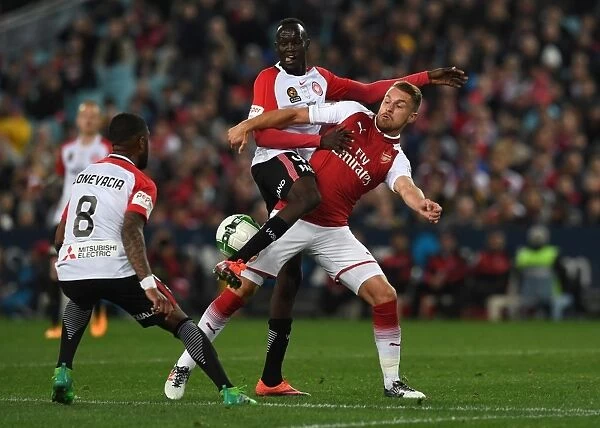 Clash in Sydney: Aaron Ramsey Faces Off Against Abraham Majok and Roly Bonevacia of Western Sydney Wanderers