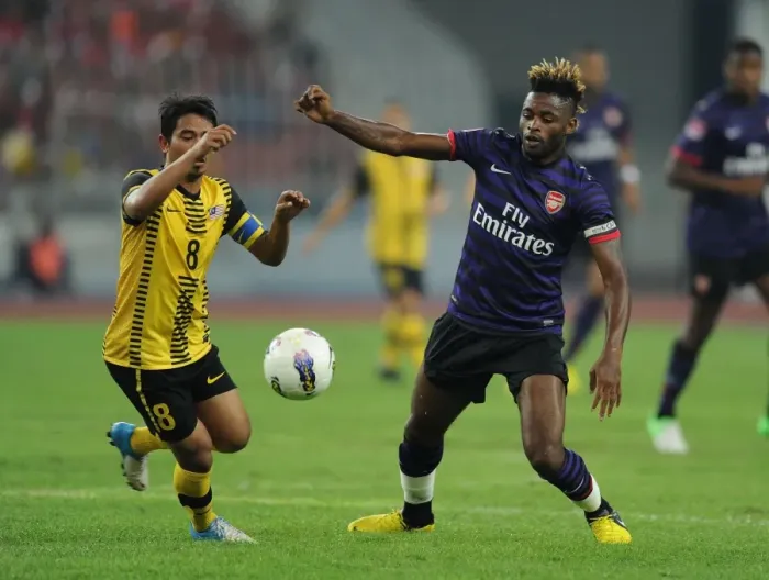 Framed Print : Clash of Talents: Alex Song vs. Safiq Bin Rahim (Malaysia XI vs. Arsenal, 2012)