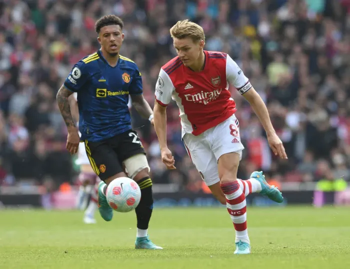 Framed Print : Clash of Talents: Arsenal's Martin Odegaard vs Manchester United's Jadon Sancho in the Premier League Showdown