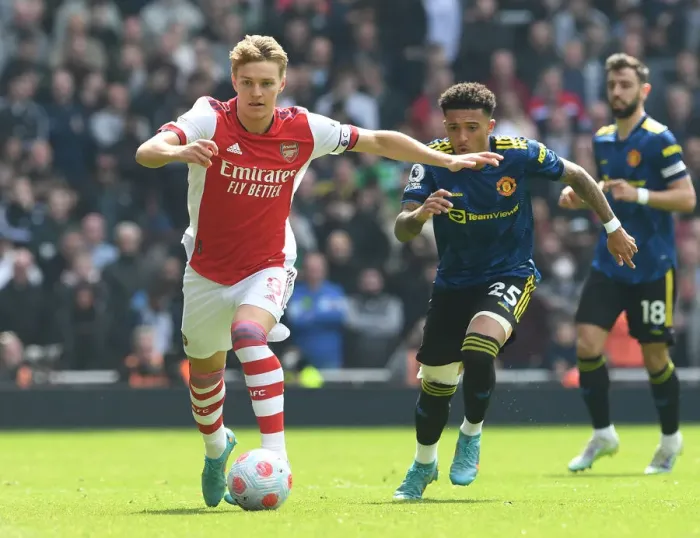 Framed Print : Clash of Talents: Arsenal's Odegaard vs Man Utd's Sancho in Premier League Showdown Framed Print : Clash of Talents: Arsenal's Odegaard vs Man Utd's Sancho in Premier League Showdown