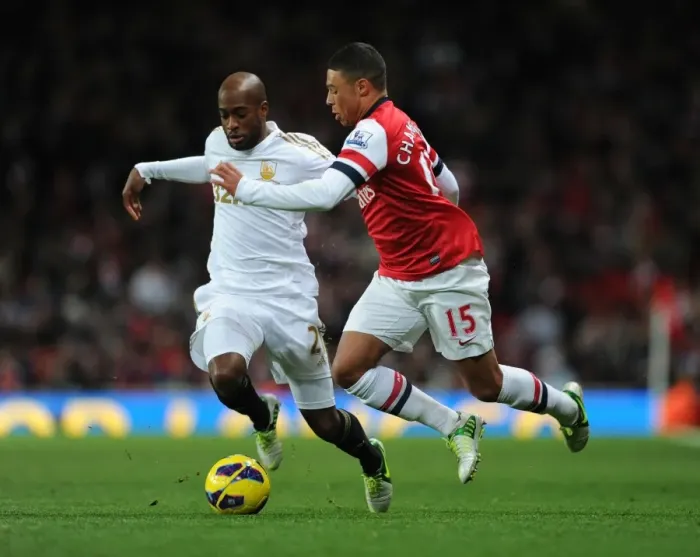 Framed Print : Clash of Talents: Oxlade-Chamberlain vs. Tiendalli - Arsenal vs. Swansea, 2012
