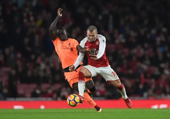 Framed Print : Clash of Talents: Wilshere vs Mane in Arsenal vs Liverpool Showdown