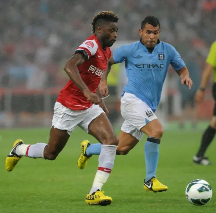 Framed Print : Clash of Titans: Alex Song vs. Carlos Tevez - Arsenal FC vs. Manchester City