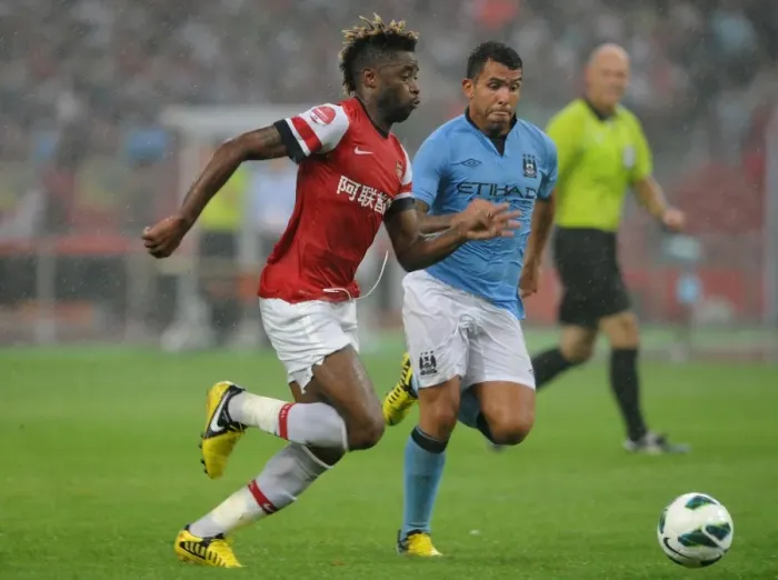 Framed Print : Clash of Titans: Alex Song vs. Carlos Tevez - Arsenal FC vs. Manchester City