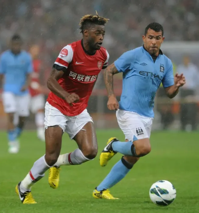Framed Print : Clash of Titans: Alex Song vs Carlos Tevez - Arsenal FC vs Manchester City, Beijing 2012 Framed Print : Clash of Titans: Alex Song vs Carlos Tevez - Arsenal FC vs Manchester City, Beijing 2012