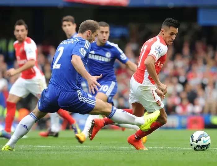 Framed Print : Clash of Titans: Alexis Sanchez vs. Branislav Ivanovic - Chelsea vs. Arsenal, Premier League 2014-15 Framed Print : Clash of Titans: Alexis Sanchez vs. Branislav Ivanovic - Chelsea vs. Arsenal, Premier League 2014-15