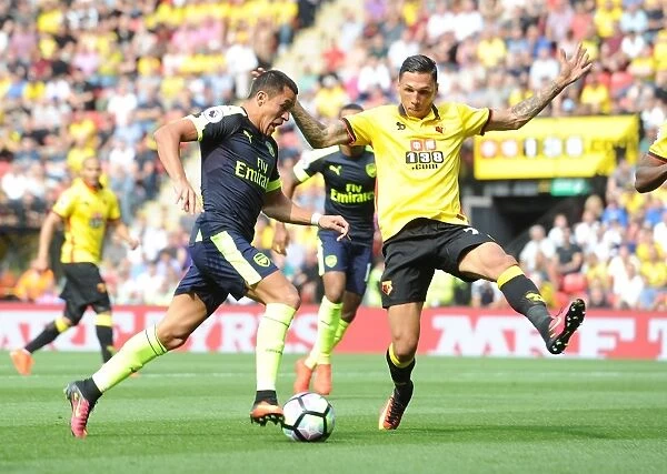 Clash of Titans: Alexis Sanchez vs. Jose Holebas in Premier League Battle