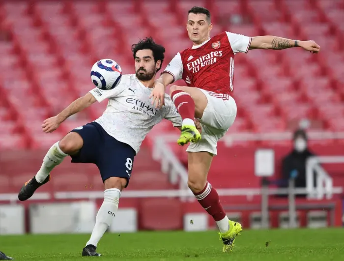 Framed Print : Clash of Titans: Arsenal vs Manchester City - Granit Xhaka vs Ilkay Gundogan in Empty Emirates Stadium Framed Print : Clash of Titans: Arsenal vs Manchester City - Granit Xhaka vs Ilkay Gundogan in Empty Emirates Stadium