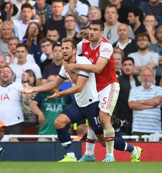Framed Print : Clash of Titans: Arsenal's Sokratis vs. Tottenham's Harry Kane - Premier League Showdown