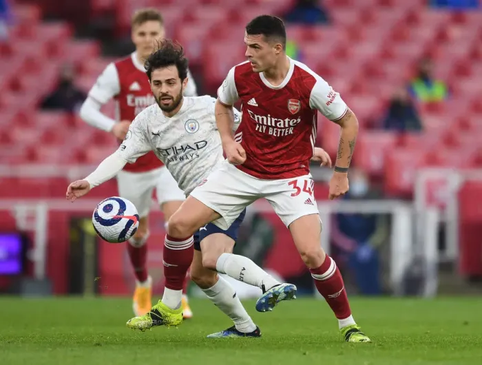 Framed Print : Clash of Titans: Arsenal's Xhaka vs Man City's Gundogan - Premier League Showdown, London 2021 Framed Print : Clash of Titans: Arsenal's Xhaka vs Man City's Gundogan - Premier League Showdown, London 2021