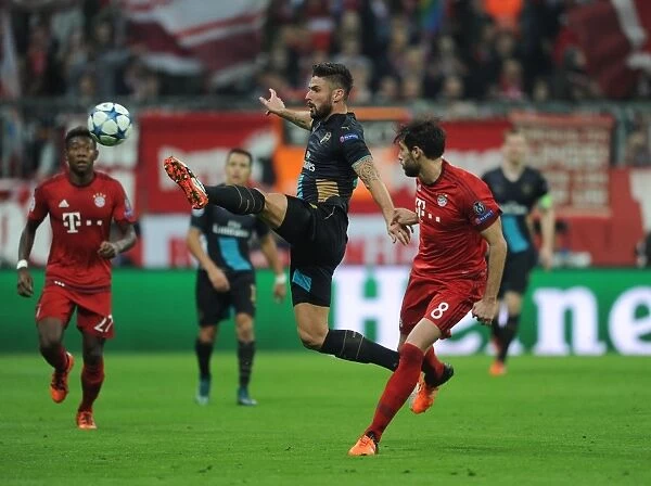 Clash of Titans: A Battle of Strength and Skill - Olivier Giroud vs. Javi Martinez, UEFA Champions League Showdown